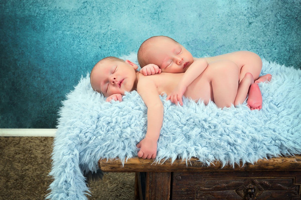 Newborn Babies Laying on Fluffy Blanket 1